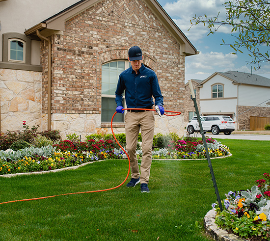 residential lawn being treated for pests